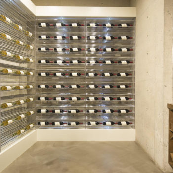 Enclosed wine room with steel swing door