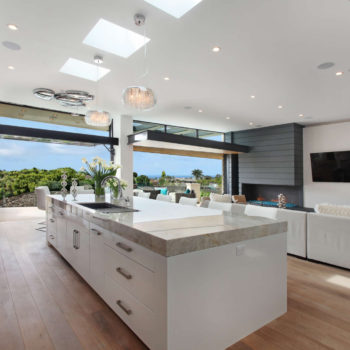 Bright kitchen featuring Euroline Steel Windows and Doors specialty doors with outdoor access.