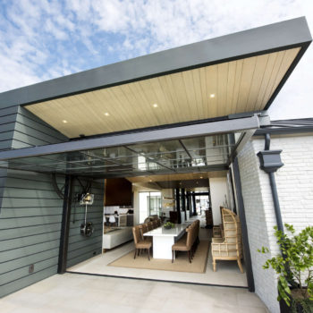 Open Euroline Steel Windows and Doors specialty doors connecting indoor and outdoor dining areas.