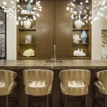 Euroline Steel Windows and Doors wine room doors with elegant interior seating and unique lighting.